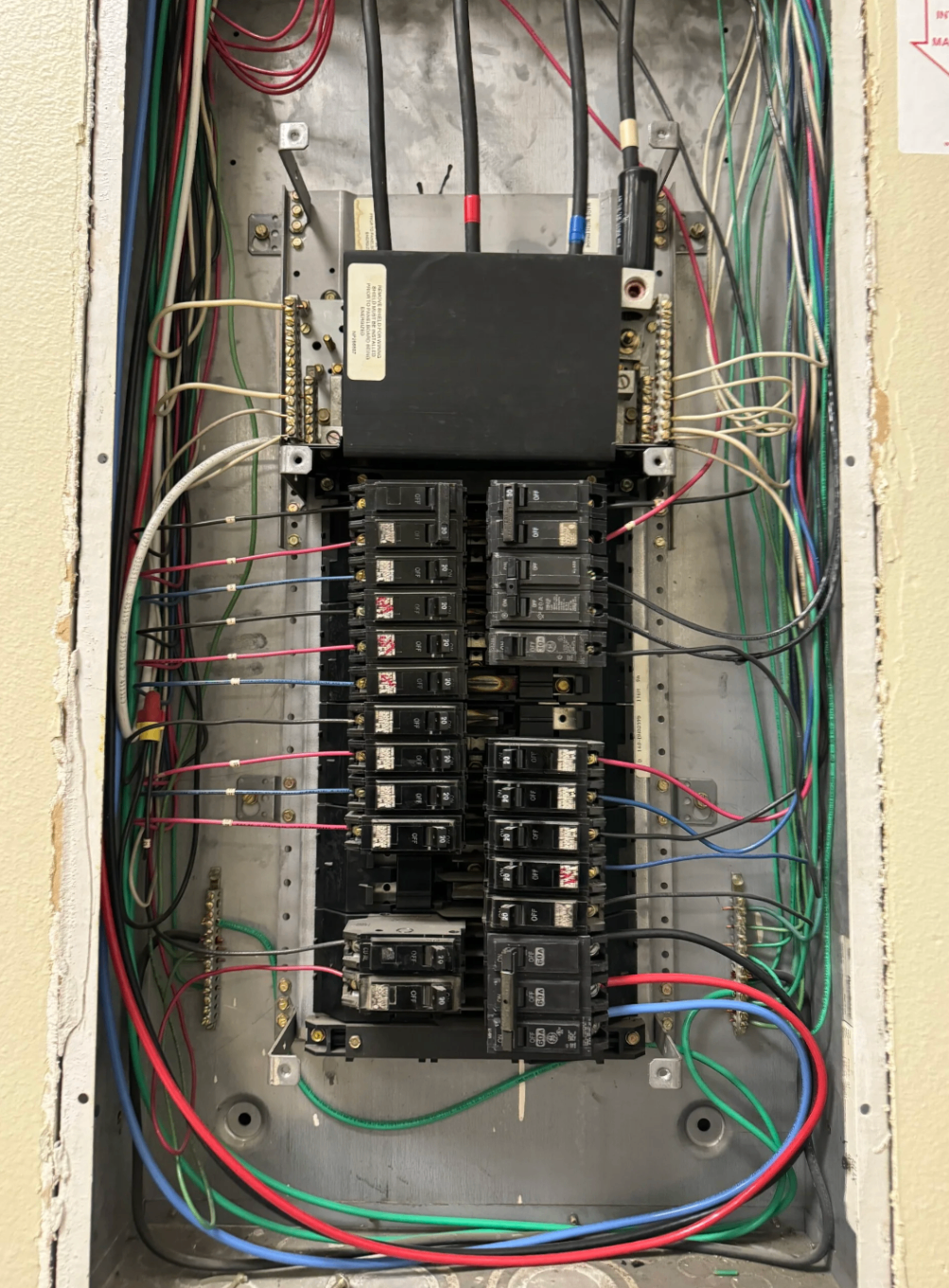 Residential electrical panel with neatly organized breakers and wiring
